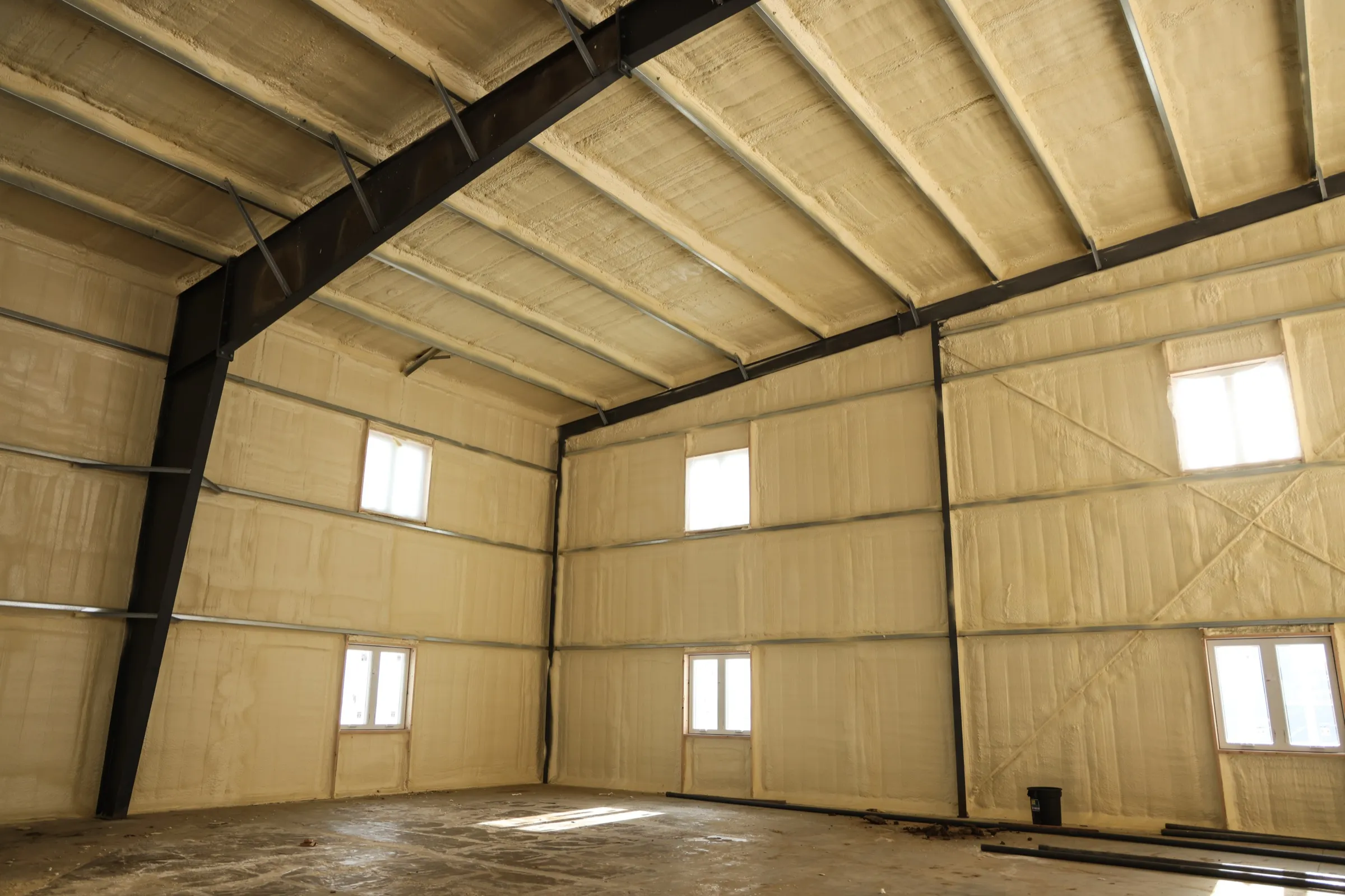 Metal building interior with insulated wall and roof panels